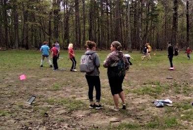 Students and presenter playing the quail habitat game at the Eco Day at the Piney Wood Rec Area